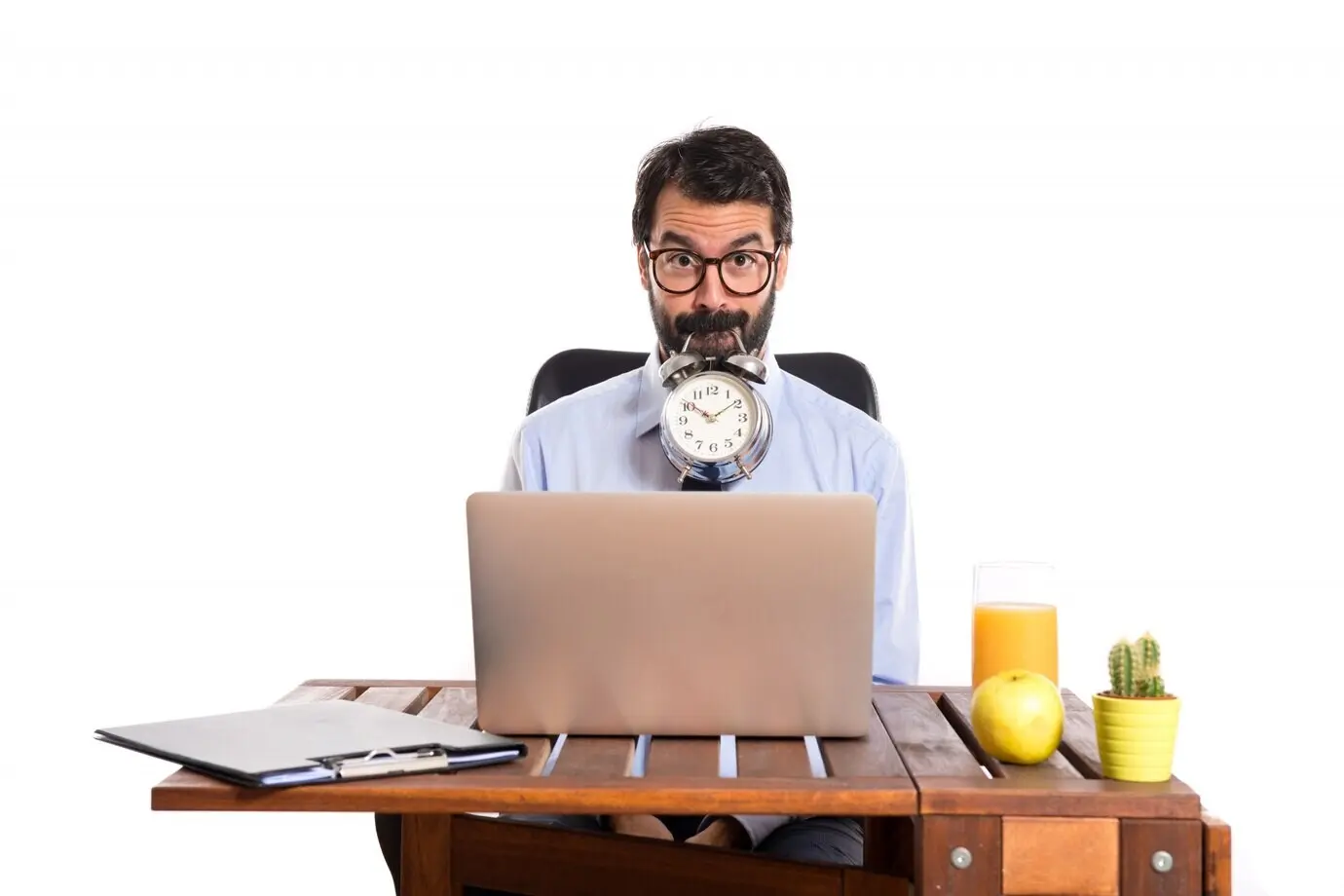 A businessman holds a clock in his office.